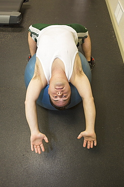 Man with Down Syndrome exercising in a gym