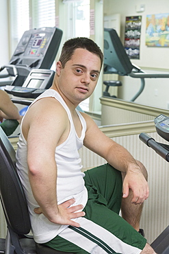 Man with Down Syndrome exercising in a gym