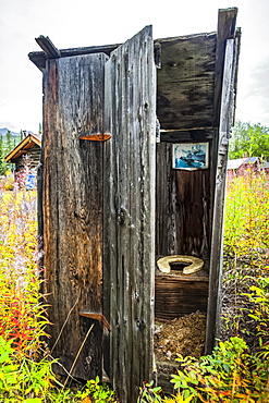 Old outhouse, Arctic Alaska in autumn; Wiseman, Alaska, United States of America