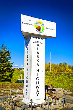 End of the Alaska Highway Marker under blue sky, Interior Alaska in autumn; Delta Junction, Alaska, United States of America