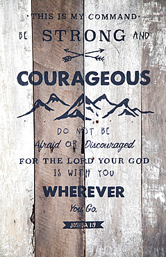 Bible verse on barn board sign with hand-painted lettering, Joshua 1:9; Calicali, Ecuador