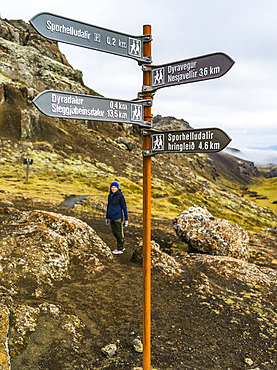 Female hiking on a trail in Southern Iceland; Grimsnes- og Grafningshreppur, Southern Region, Iceland