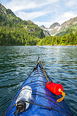 Kayaker paddling in Prince William Sound; Alaska, United States of America