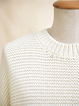 White knit sweater on mannequin; Studio