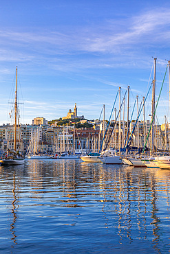 Marseille Harbour and Notre-Dame de la Garde at sunrise, Marseille, Bouches-du-Rhone, Provence-Alpes-Cote d'Azur, France, Western Europe