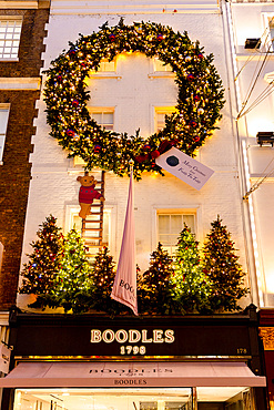 Christmas Decorations at Boodles Jewellery Shop at dusk, New Bond Street, London, England, United Kingdom