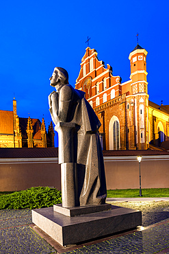 A Statue of the Polish Poet Adam Mickiewicz in front of St. Anne's Church and the Church of St. Francis and St. Bernard, Vilnius, Lithuania, Northern Europe