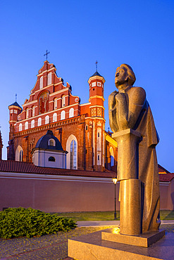 A Statue of the Polish Poet Adam Mickiewicz in front of St. Anne's Church and the Church of St. Francis and St. Bernard at Dusk, Vilnius, Lithuania, Northern Europe