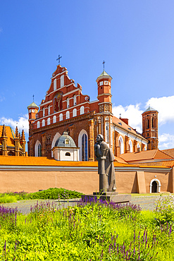 A Statue of the Polish Poet Adam Mickiewicz in front of St. Anne's Church and the Church of St. Francis and St. Bernard, Vilnius, Lithuania, Northern Europe