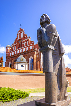 A Statue of the Polish Poet Adam Mickiewicz in front of St. Anne's Church and the Church of St. Francis and St. Bernard, Vilnius, Lithuania, Northern Europe