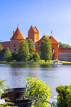 Yacht in front of Trakai Island Castle, Trakai, Lithuania, Northern Europe