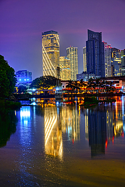 Skyscrapers reflecting in Beira Lake at sunset, Colombo, Sri Lanka