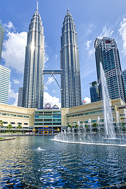 Petronas twin towers and Symphony Lake in KLCC park, Kuala Lumpur, Malaysia, Asia
