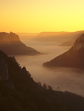 View from Eichfelsen Rock on Schloss Werenwag Castle and Danube Valley at sunrise, Upper Danube Nature Park, Swabian Alb, Baden Wurttemberg, Germany, Europe