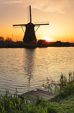 Windmill at sunrise, Kinderdijk, UNESCO World Heritage Site, South Holland, Netherlands, Europe