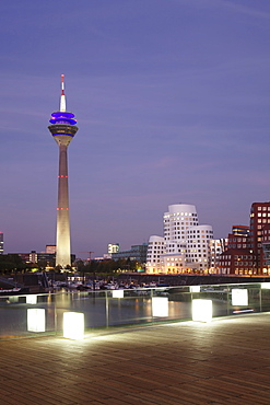 Media Harbour (Medienhafen), Neuer Zollhof building designed by Frank Gehry and Rhineturm tower, Dusseldorf, North Rhine Westphalia, Germany, Europe