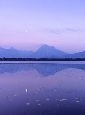 Allgau Alps reflecting in Hopfensee Lake at moonrise, near Fussen, Allgau, Bavaria, Germany, Europe