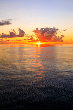 Sunset over beautiful calm sea, interesting clouds, vibrant colours, St. Kitts, St. Kitts and Nevis, Leeward Islands, West Indies, Caribbean, Central America