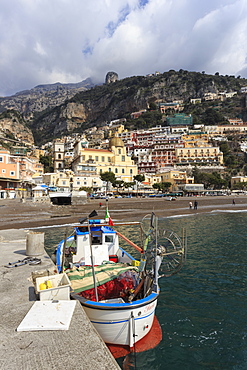 Fishing boat at quayside and Positano town, Costiera Amalfitana (Amalfi Coast), UNESCO World Heritage Site, Campania, Italy, Europe 