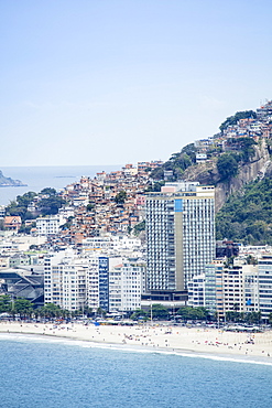 Elevated view of Copacabana Beach, apartment blocks and the Pavao Pavaozinhao favela slum, Rio de Janeiro, Brazil, South America