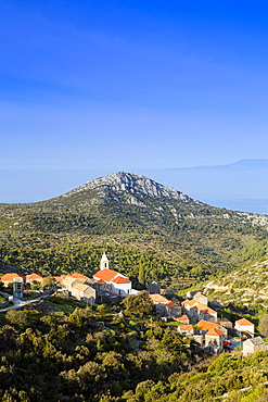 Velo Grablje village and mountains against the Adriatic Sea, Hvar Island, Dalmatia, Croatia, Europe