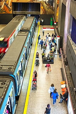 A subway station showing a train and commuter platform on the Metro de Santiago rapid transit system station, Santiago, Chile, South America