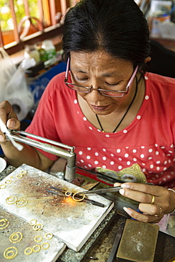 A goldsmith working in a jewellery factory, Thailand, Southeast Asia, Asia