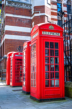 Traditional red metal K6 telephone boxes designed by Sir Giles Gilbert Scott, Holborn, London, England, United Kingdom, Europe