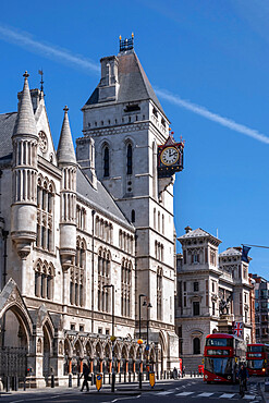 The Royal Courts of Justice, Central Civil Court, and red London bus on Fleet Street, Holborn, London, England, United Kingdom, Europe