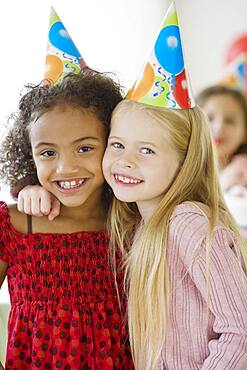 Multi-ethnic girls at birthday party