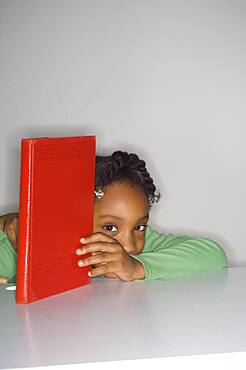 African girl holding book