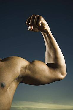 African American man flexing biceps