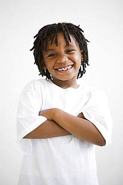 African boy with arms crossed