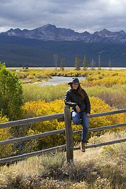 Caucasian woman under Sawtooth Range, Stanley, Idaho, United States