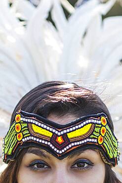 Native American woman wearing traditional headdress