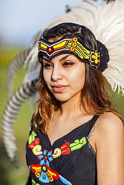 Native American woman wearing traditional headdress