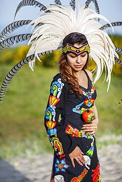 Native American woman wearing traditional headdress