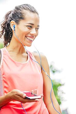 Indian athlete listening to mp3 player