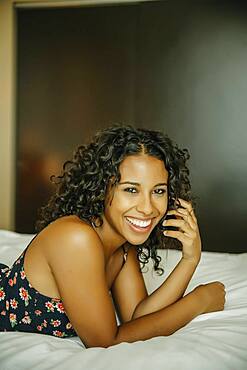 Close up of woman laying on hotel bed