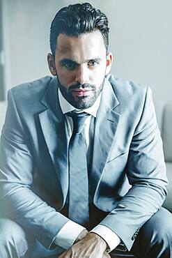 Close up of serious businessman sitting