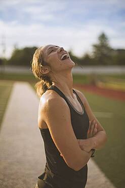 Caucasian athlete standing on sports field