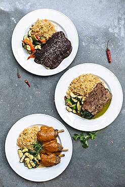 Plates of food with vegetables and rice