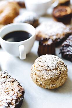 Close up of variety of pastries and coffee