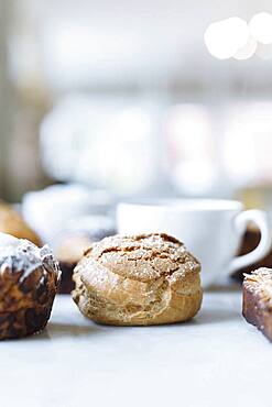 Close up of variety of pastries and coffee