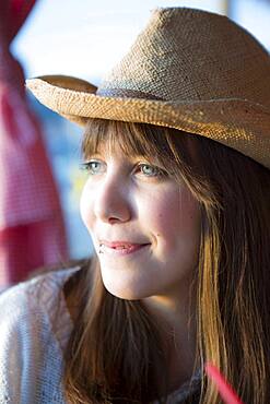 Woman wearing straw hat outdoors