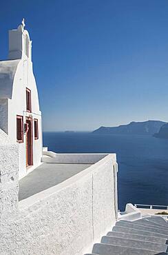 Building on hillside over seascape