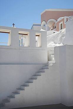 Steps on building wall under blue sky