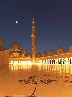 Illuminated colonnade, domes and tower at night