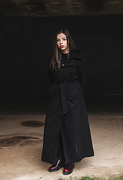 Portrait of serious Caucasian woman wearing black coat