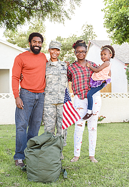 Portrait of black woman soldier with family